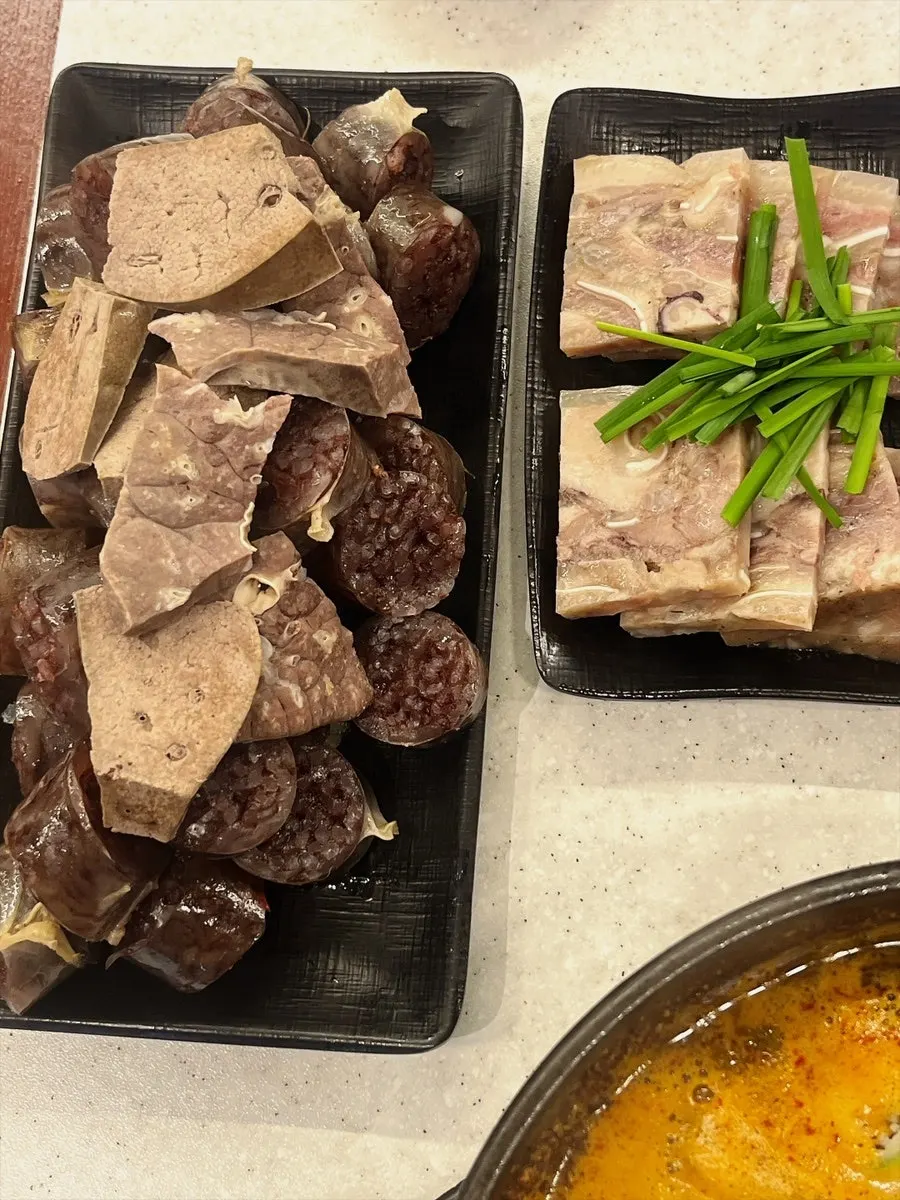 A solo meal spread of gukbap and sundae