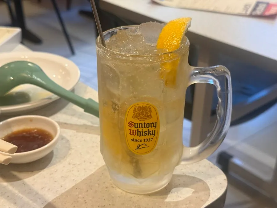 A highball served alongside dinner