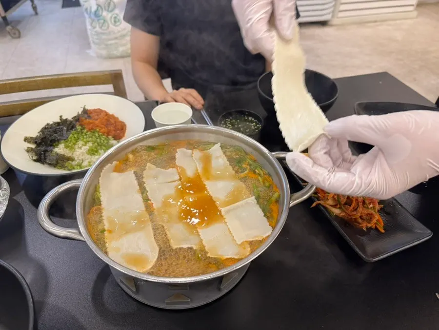 A bite of meat, minari, and mushroom together