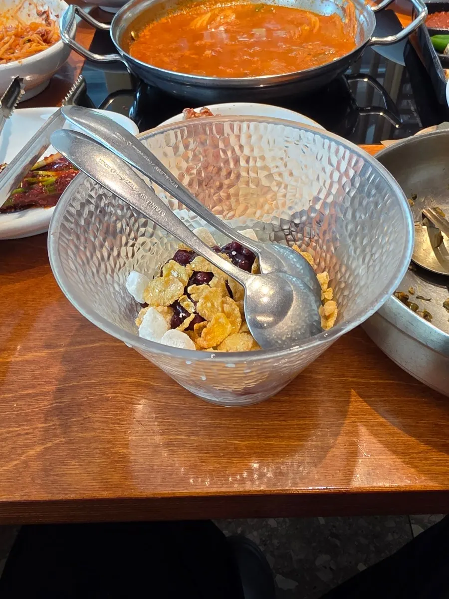 Close-up of patbingsu topped with rice cake and cereal