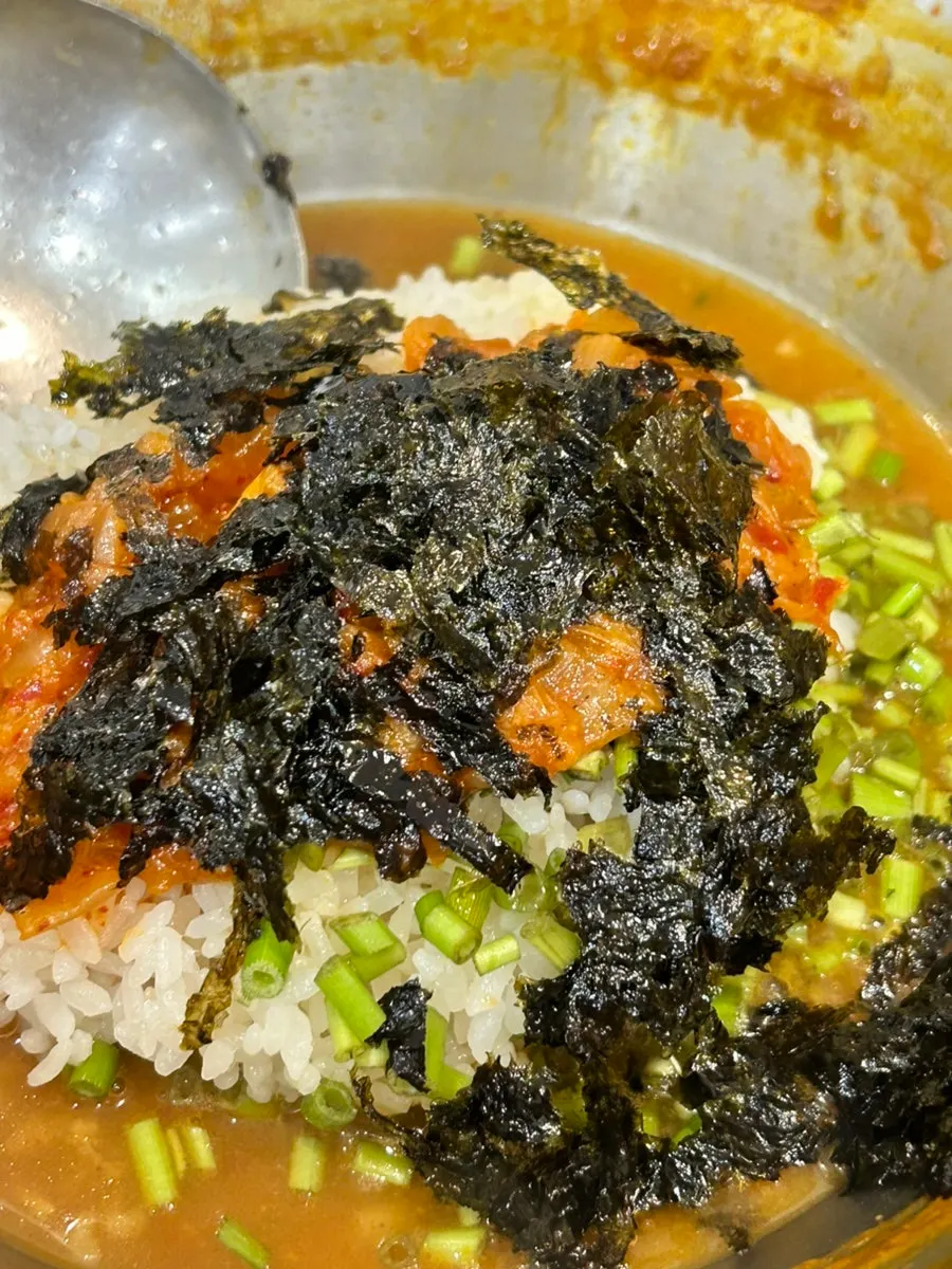 Kalguksu noodles cooking in the broth