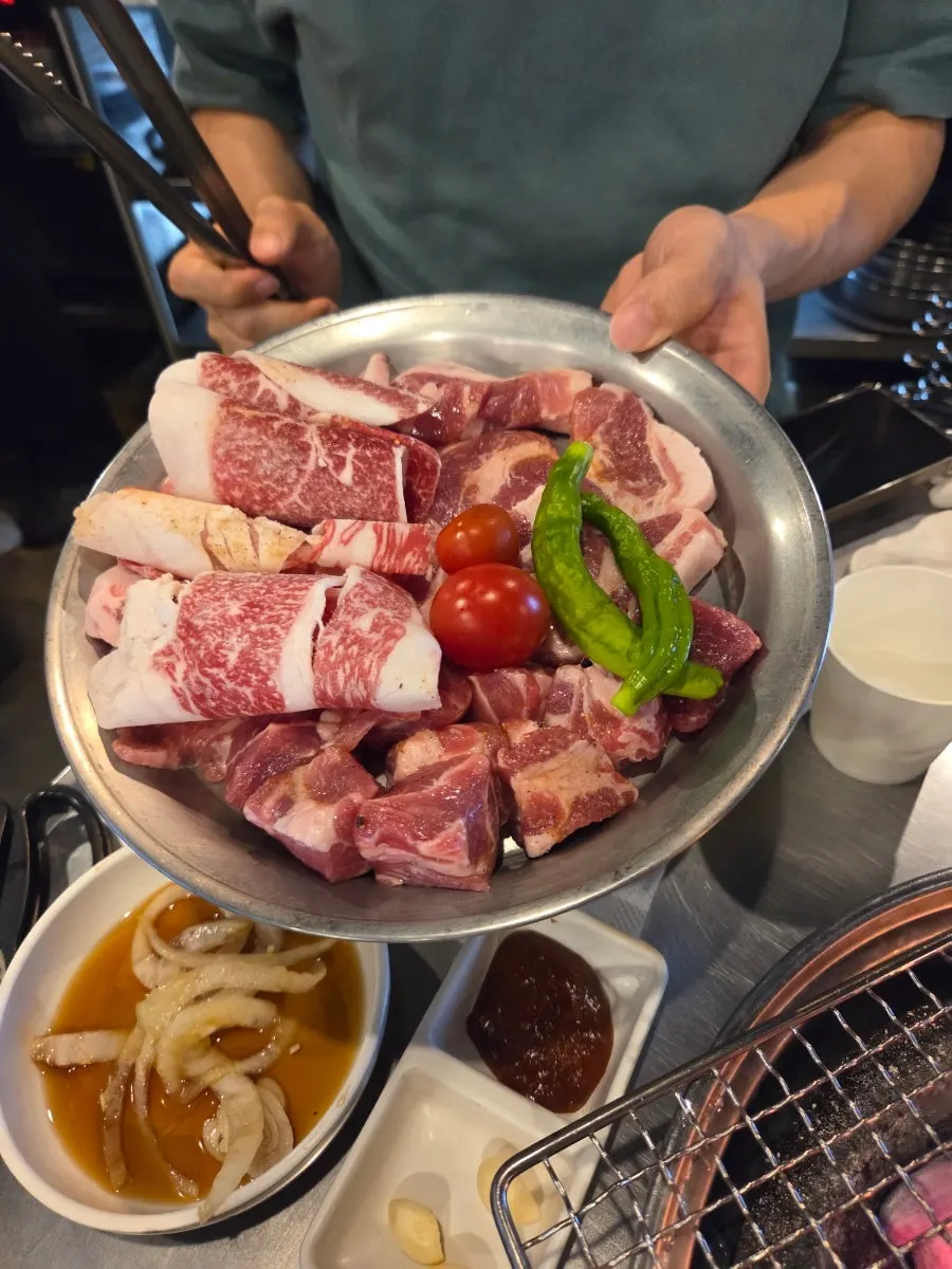 Self-serve sauce corner with spicy pepper muchim and dried radish