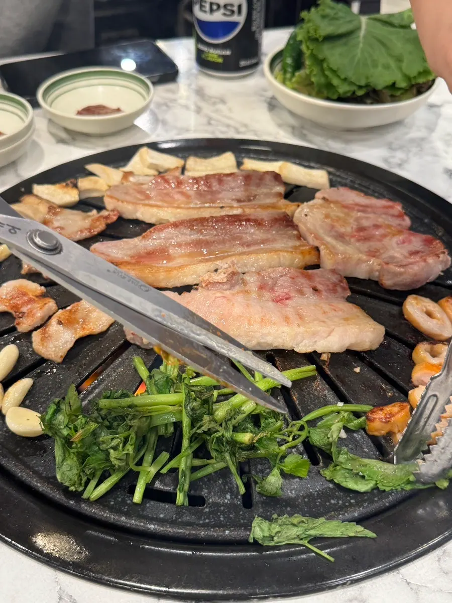 Doenjang jjigae simmering on the other burner