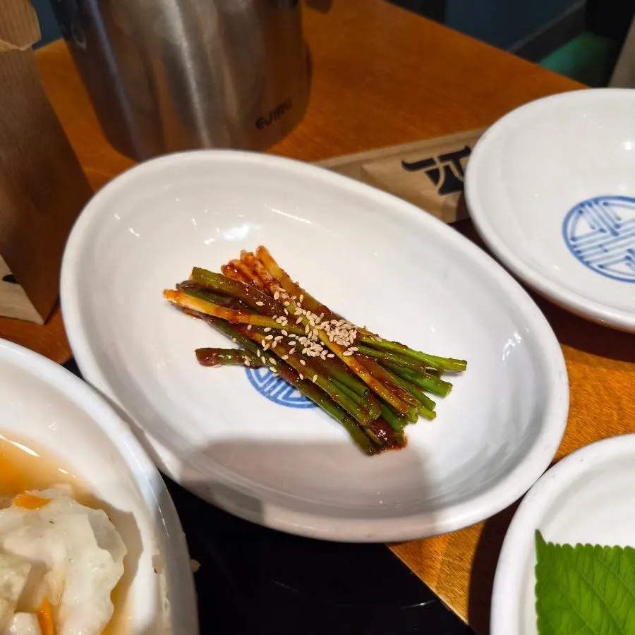 Table laid out with side dishes at Gogi 9dan