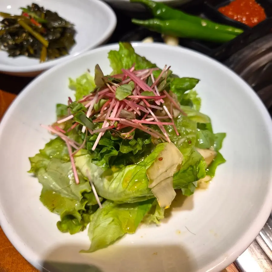 Neatly arranged plates of side dishes