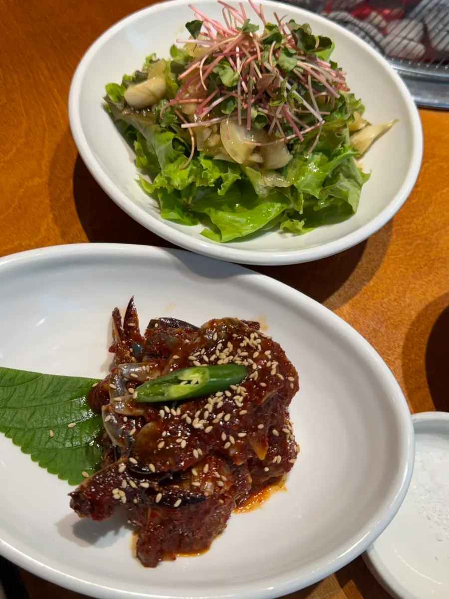 Side dish spread with japchae and green onion kimchi
