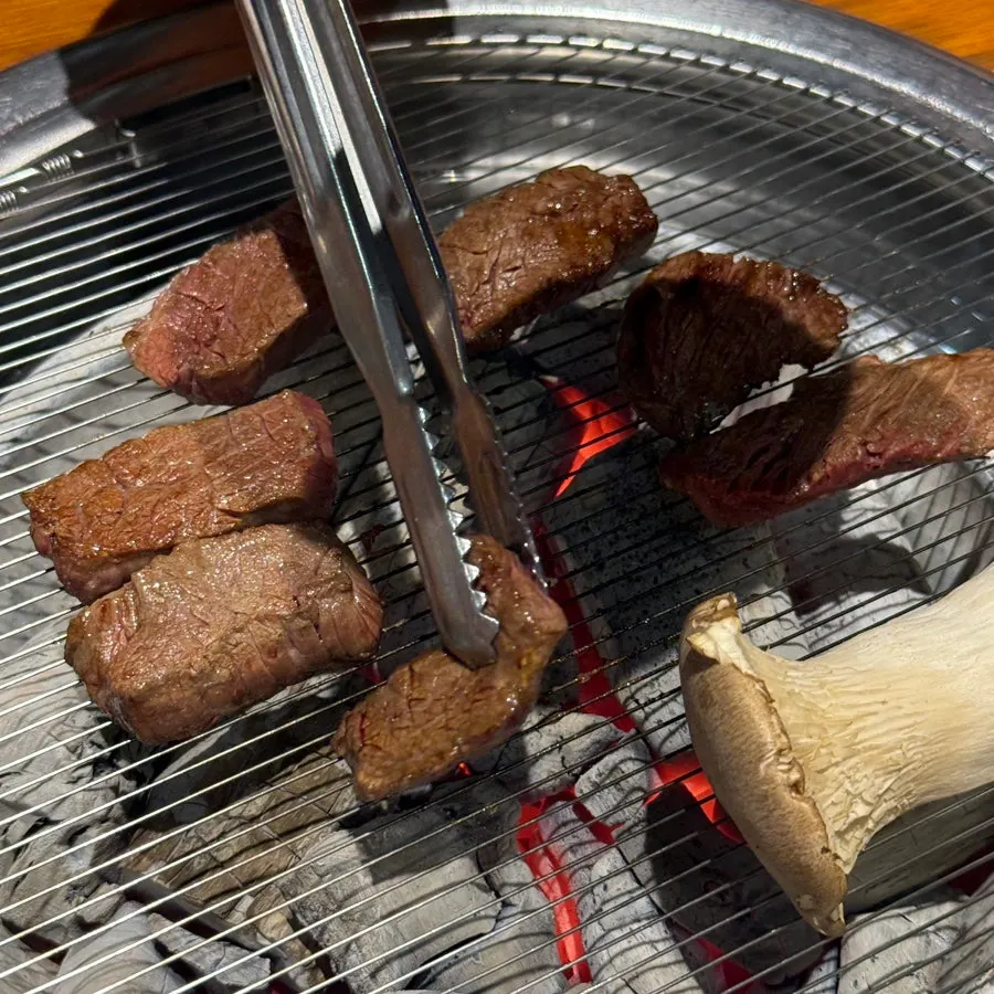 Fresh ribs and skirt steak on the charcoal grill