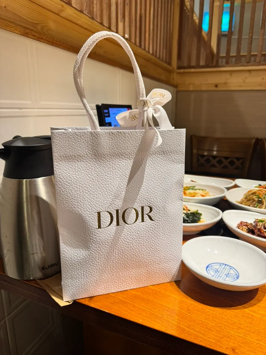 A Dior wallet given as a wedding gift from a friend