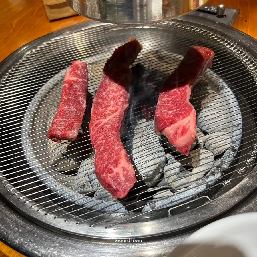 Flower ribs grilling over charcoal
