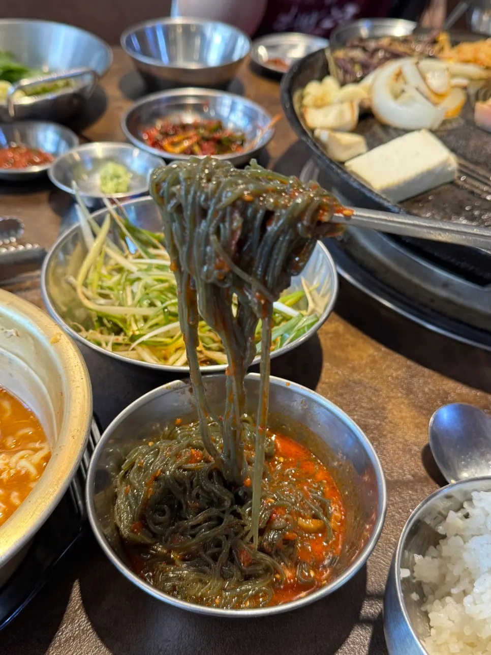Ramyeon boiled in a yellow tin pot
