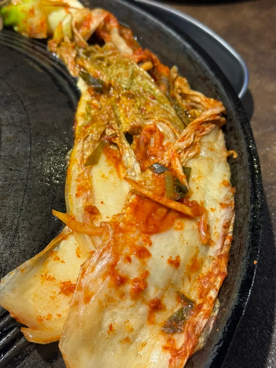 Grilled house-made kimchi soaked in meat fat