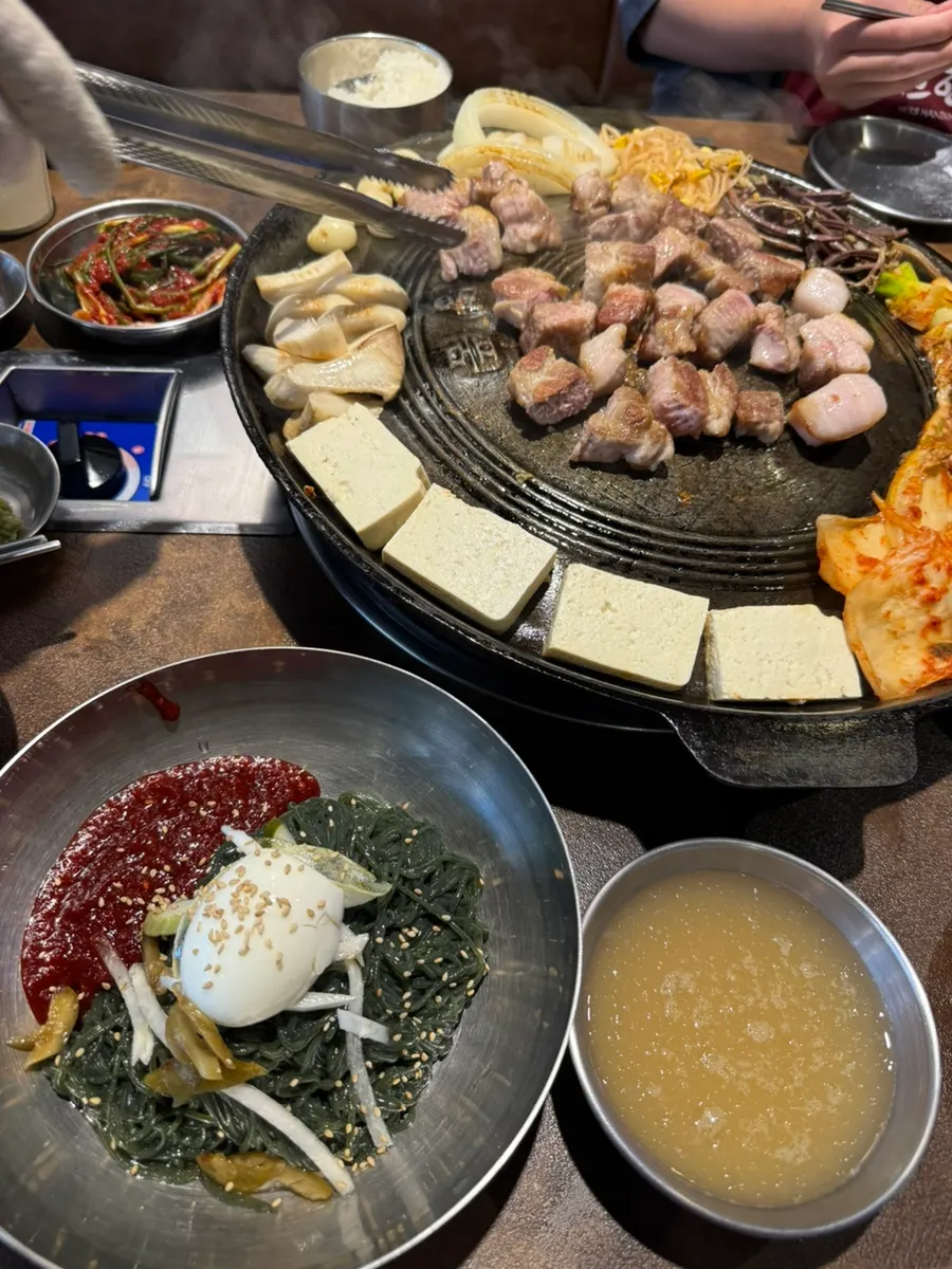 Ramyeon served bubbling in a large metal bowl