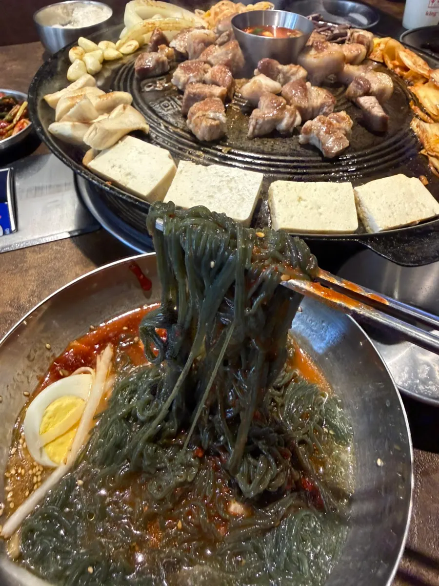 A bowl of bibim gomchwi naengmyeon
