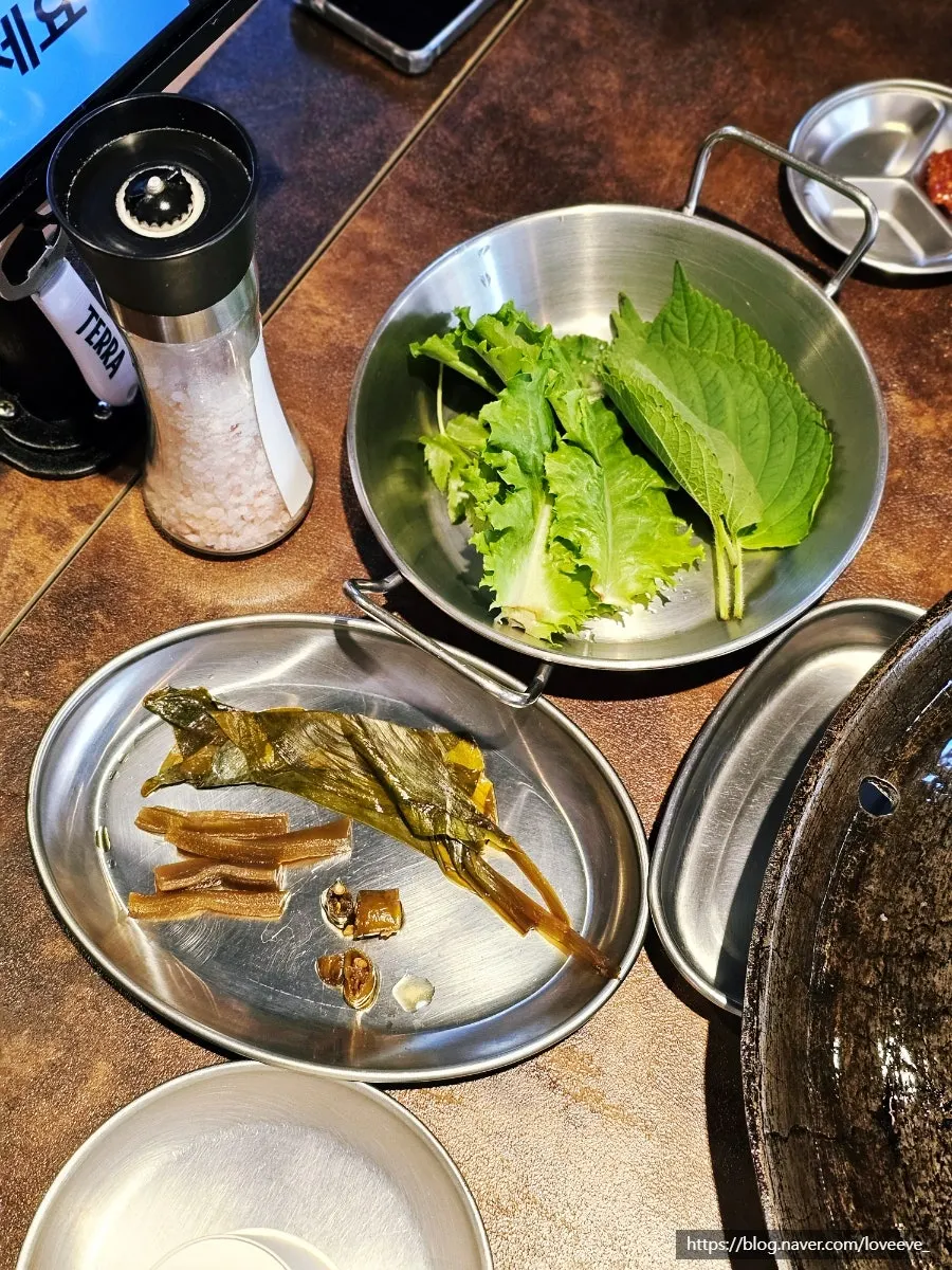 Vegetables and side dishes set out with the cauldron lid