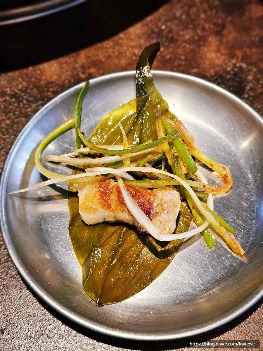 Pork belly wrapped in myeong-i namul (mountain garlic leaves)