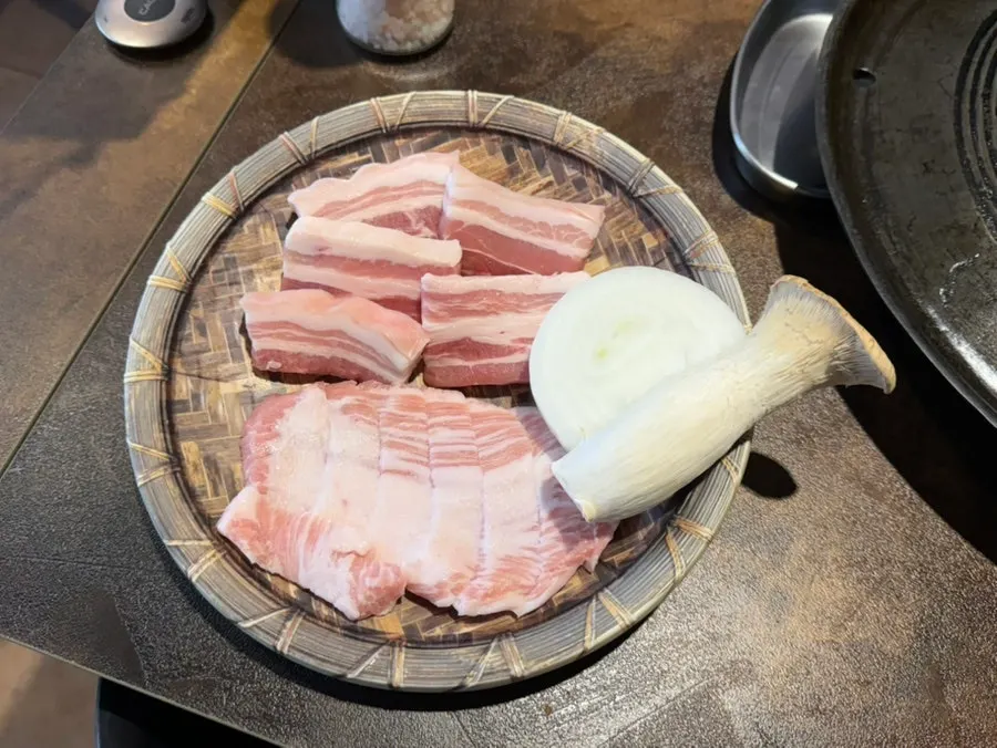 Plate of antibiotic-free raw pork belly and pork jowl