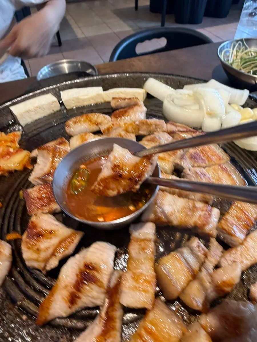 Lettuce wrap topped with well-grilled meat