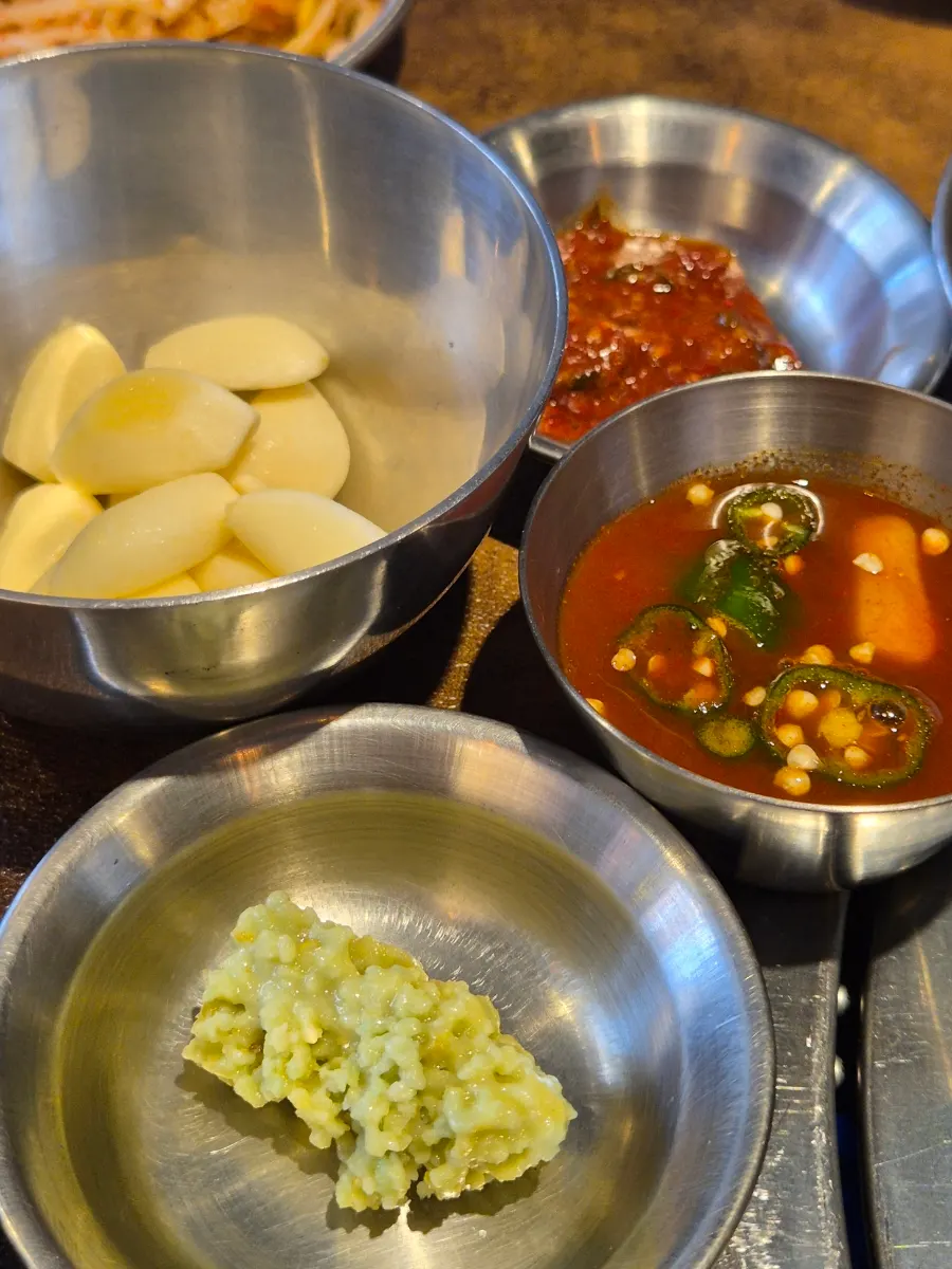 Bracken and bean sprouts to be grilled on the cauldron lid