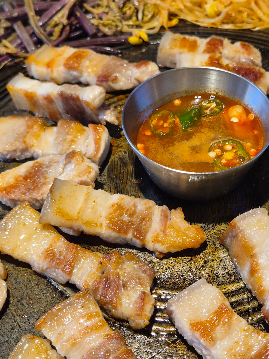 A piece of pork belly dipped in myeoljeot