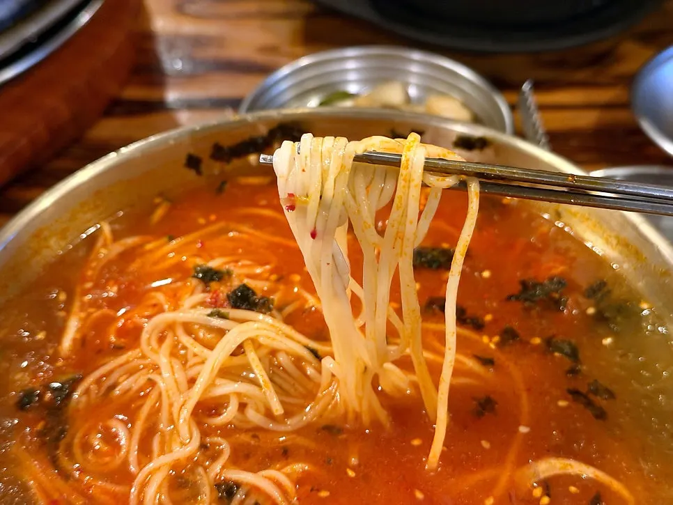 Kimchi mari guksu eaten alongside the grilled meat