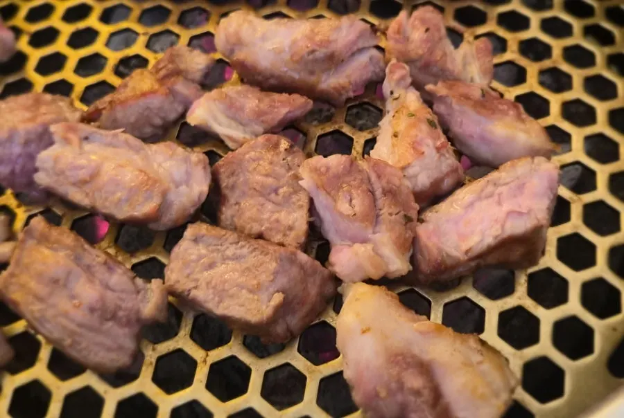 Pork belly and neck placed on the charcoal grill