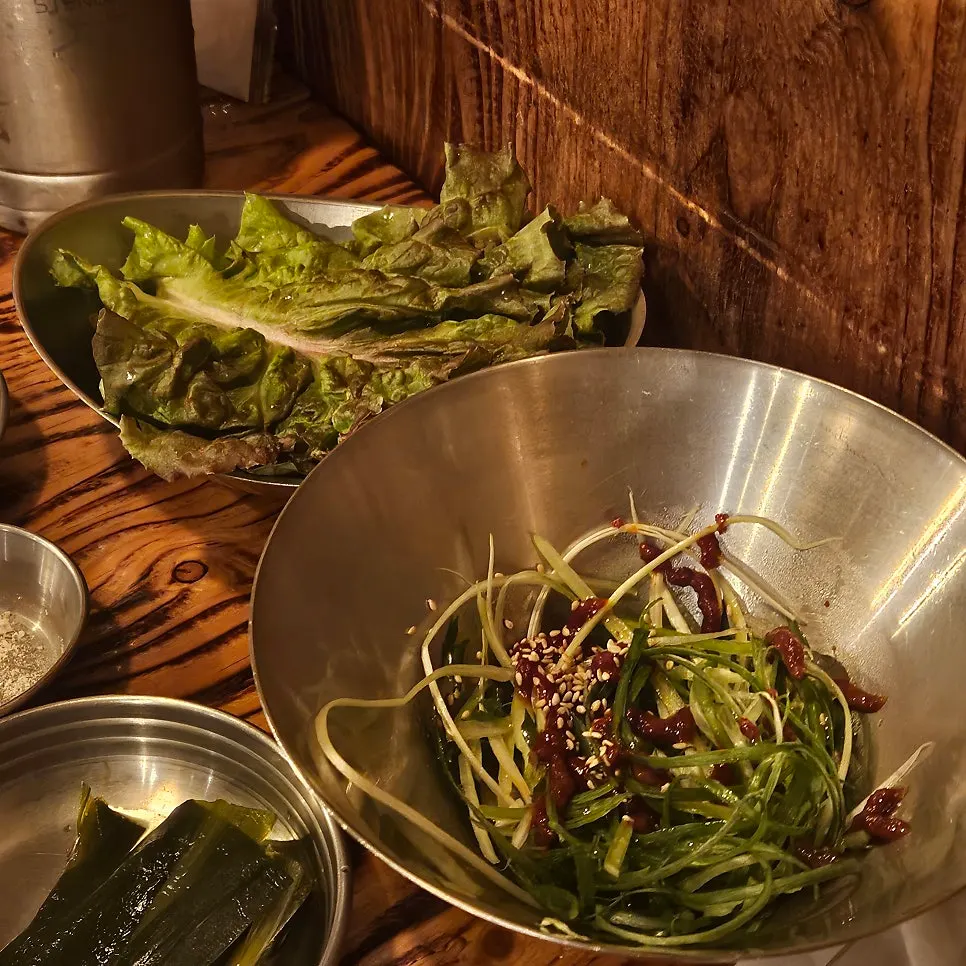 Plate of myeongi namul and green onion salad