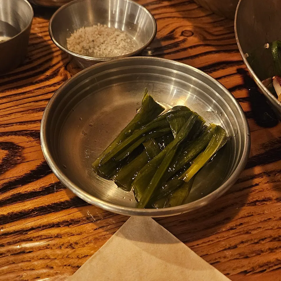 Table setting with salt, wasabi, and ssamjang