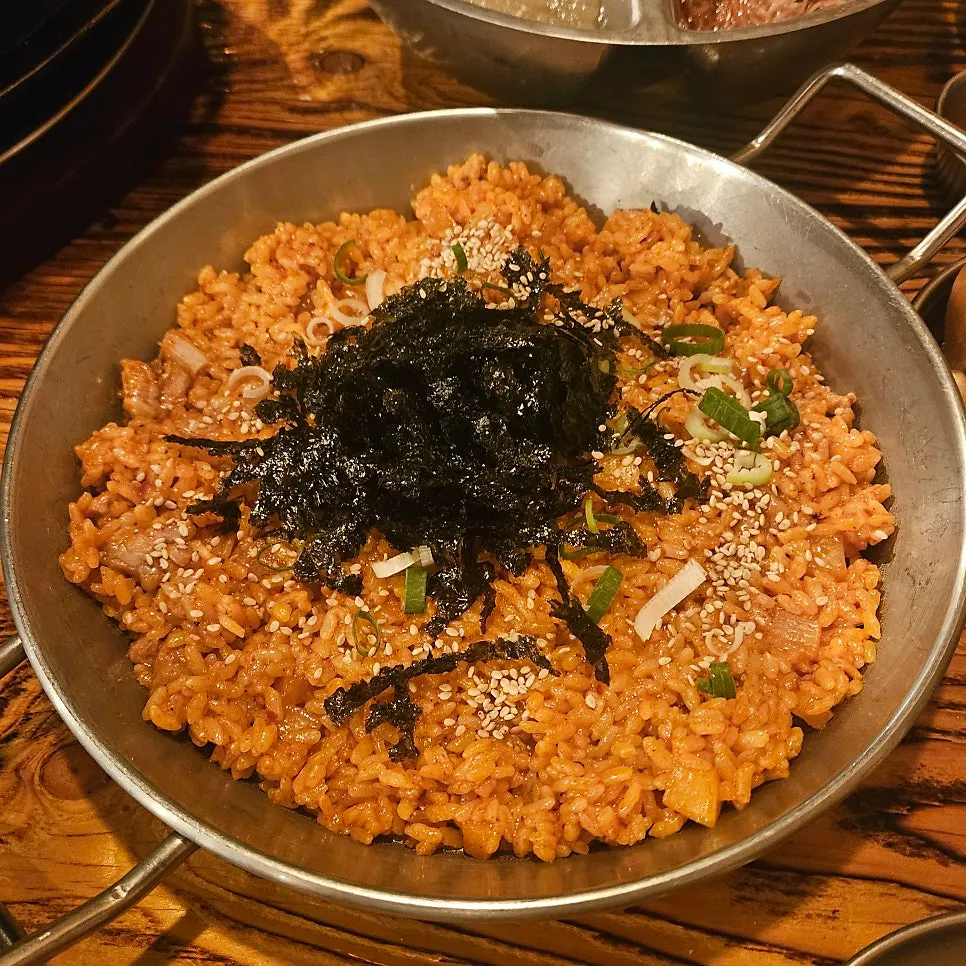 Dice rice topped with seaweed flakes and sesame seeds