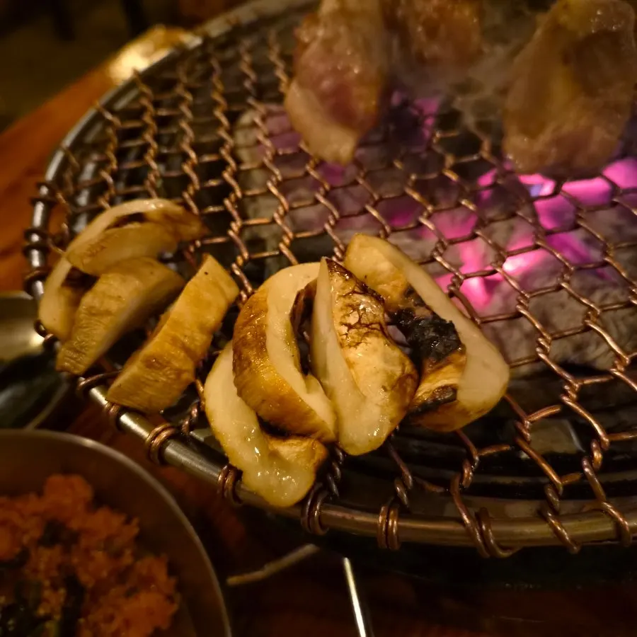 Glass of Asahi draft beer enjoyed with the meat
