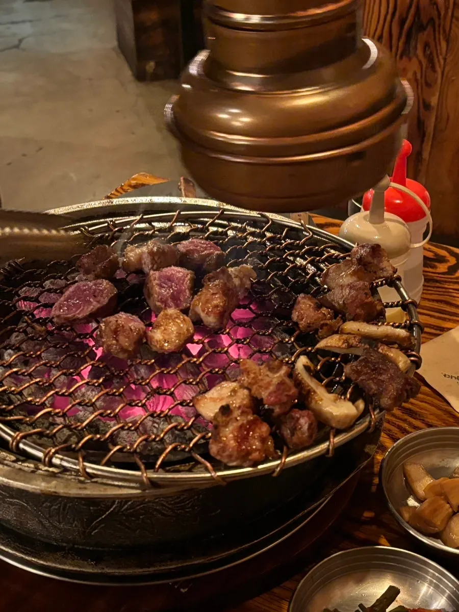 Naengmyeon served alongside the meat
