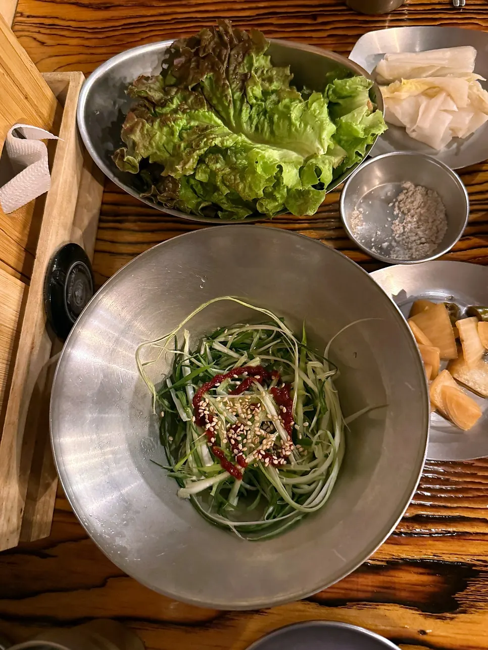 Salt, wasabi, ssamjang, scallion salad, and lettuce arrangement