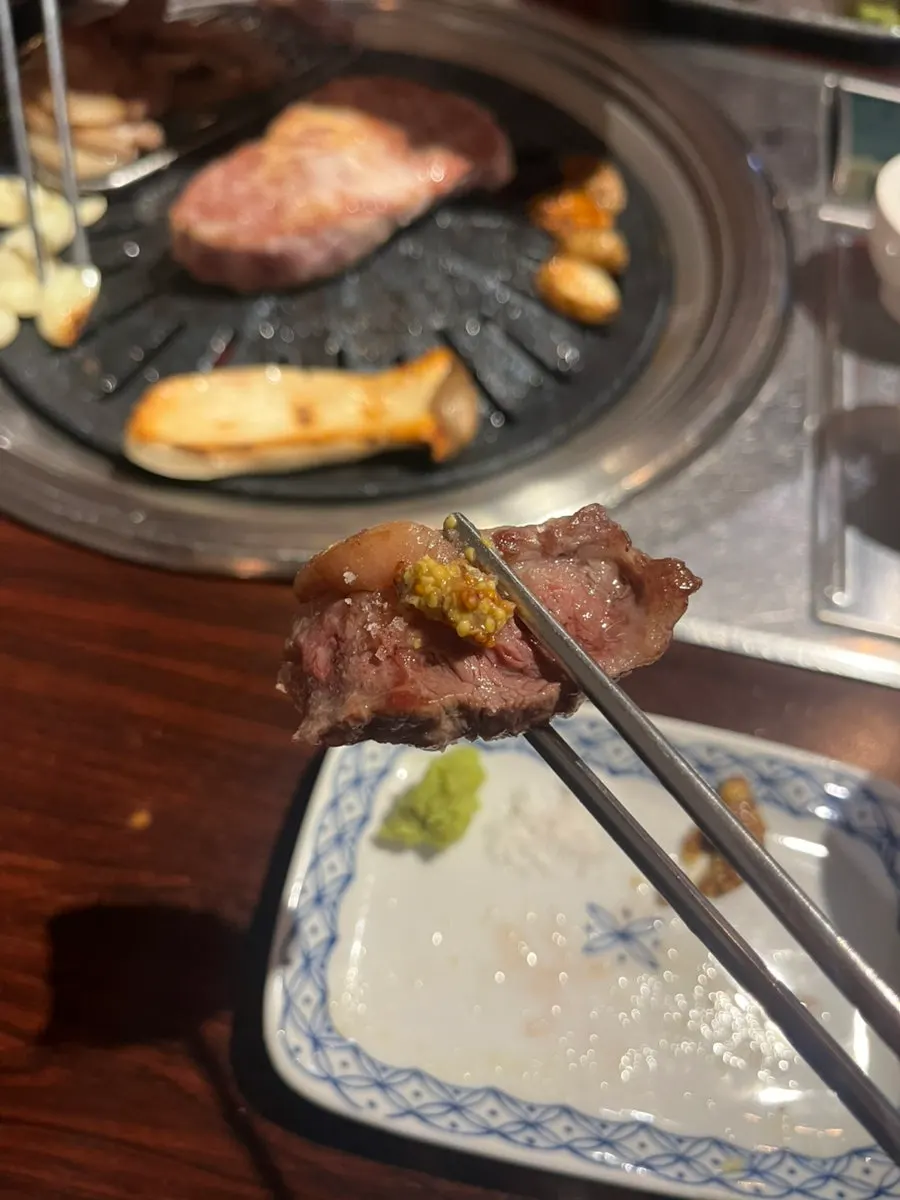 A piece of rib finger served with whole grain mustard