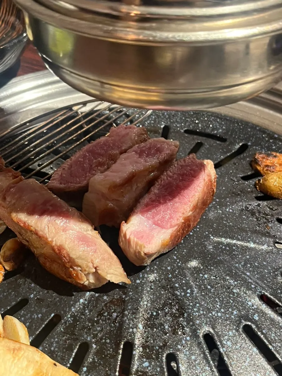 Dry-aged fresh pork neck grilled thick like a steak