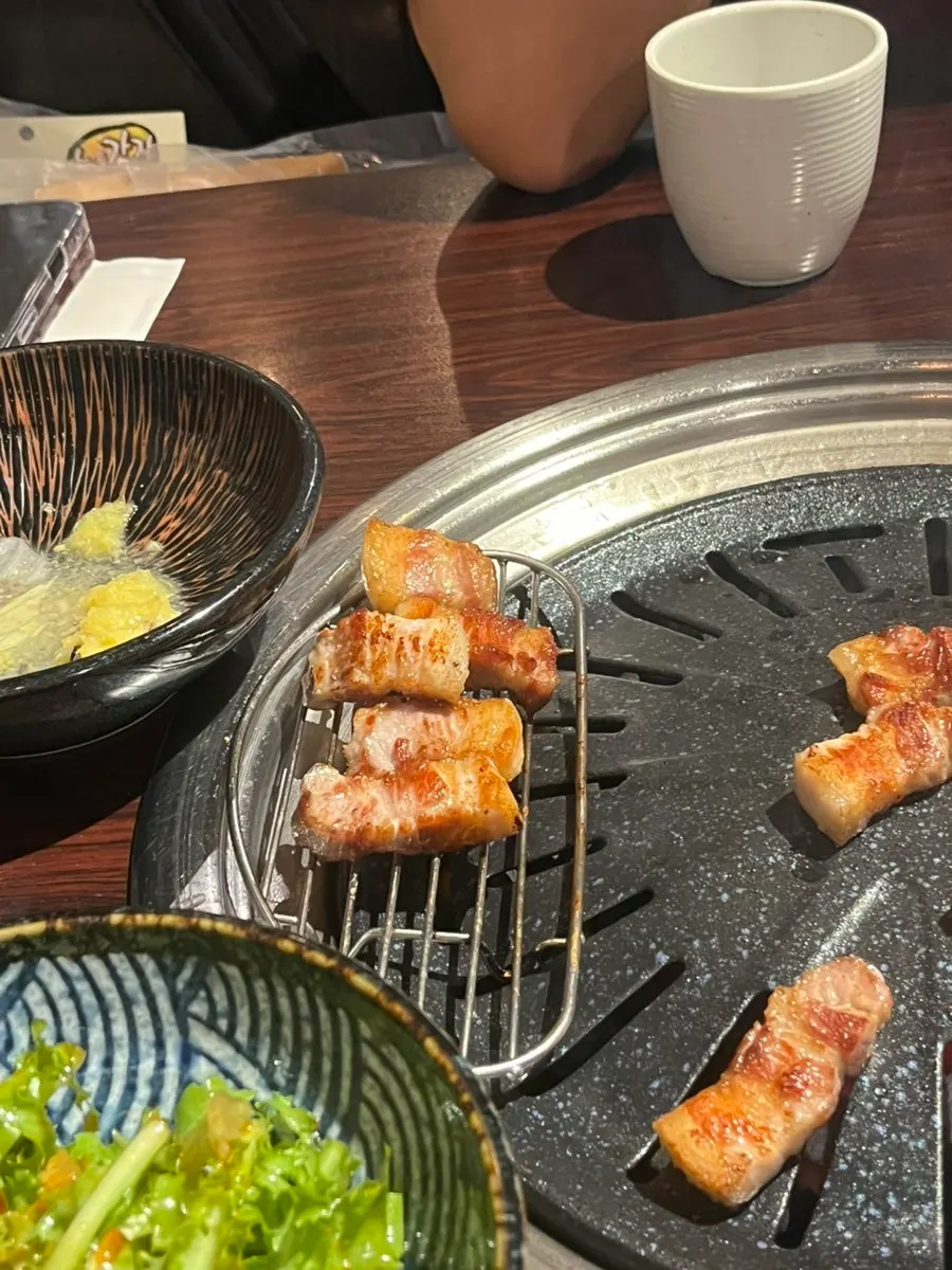 Fresh pork belly grilled to a golden finish at Gogi Salon