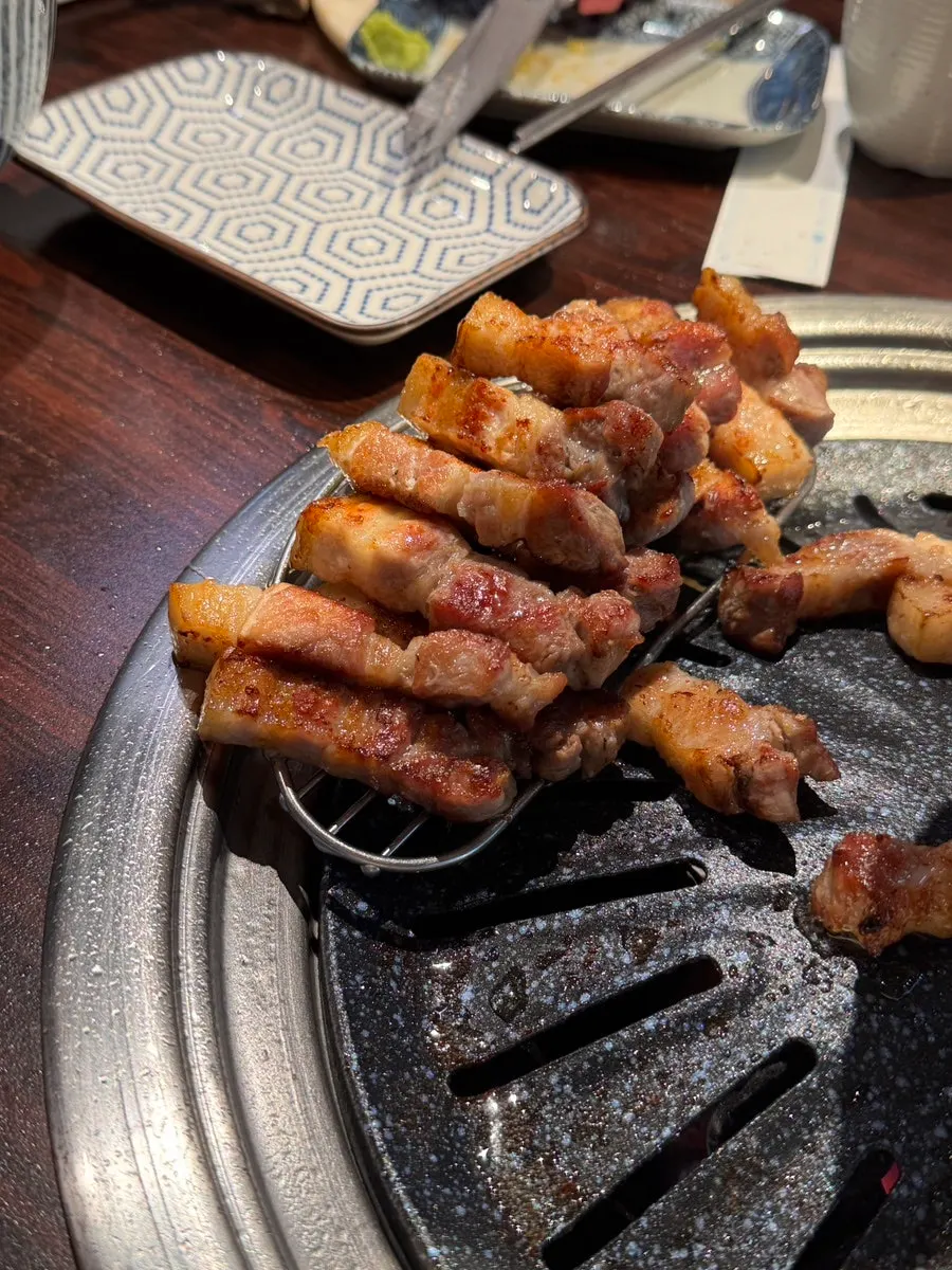 A piece of pork belly with condiments