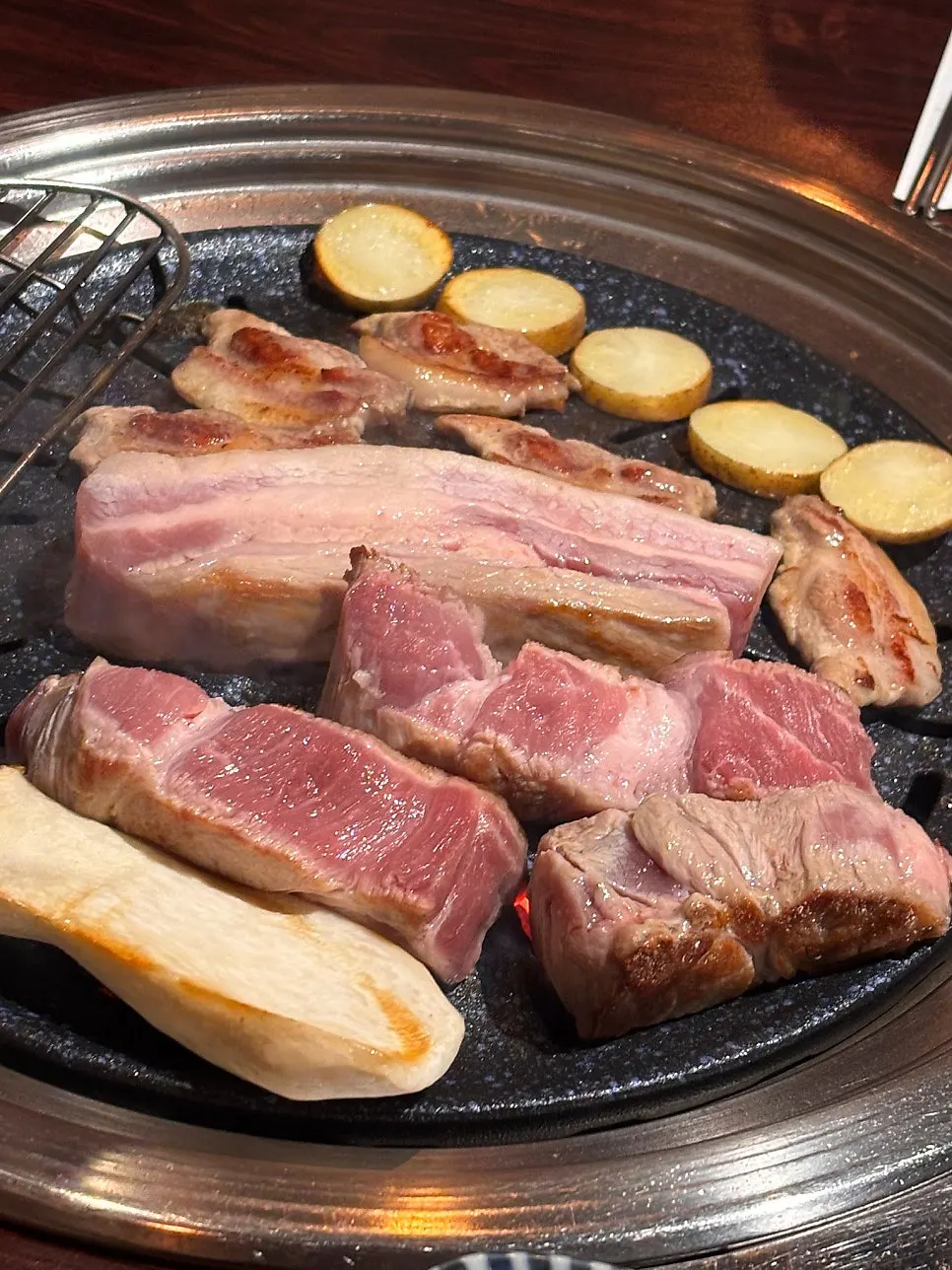Plate of raw pork neck and pork belly from certified Dodram Hanwoo pork