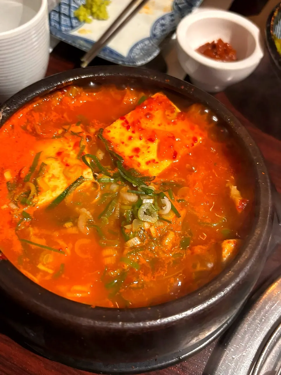 Doenjang stew served bubbling in a stone pot