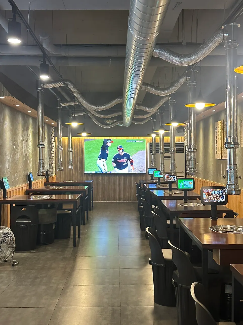 Main hall seating with a TV mounted on the wall