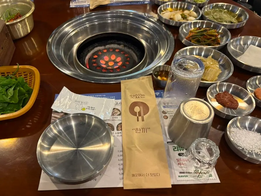 Basic table setting with lettuce, pickles, kimchi and sauces