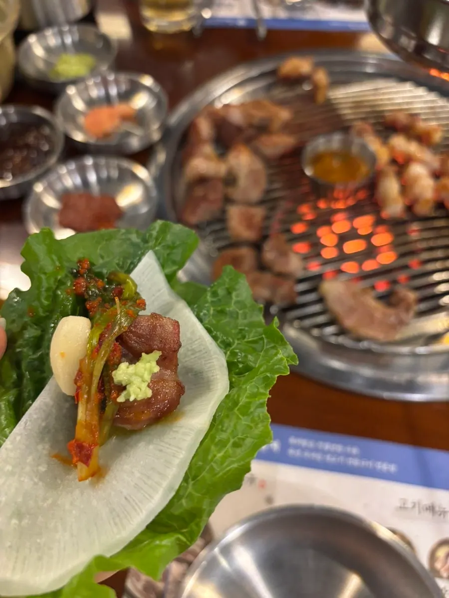 Well-cooked pork with a lettuce wrap