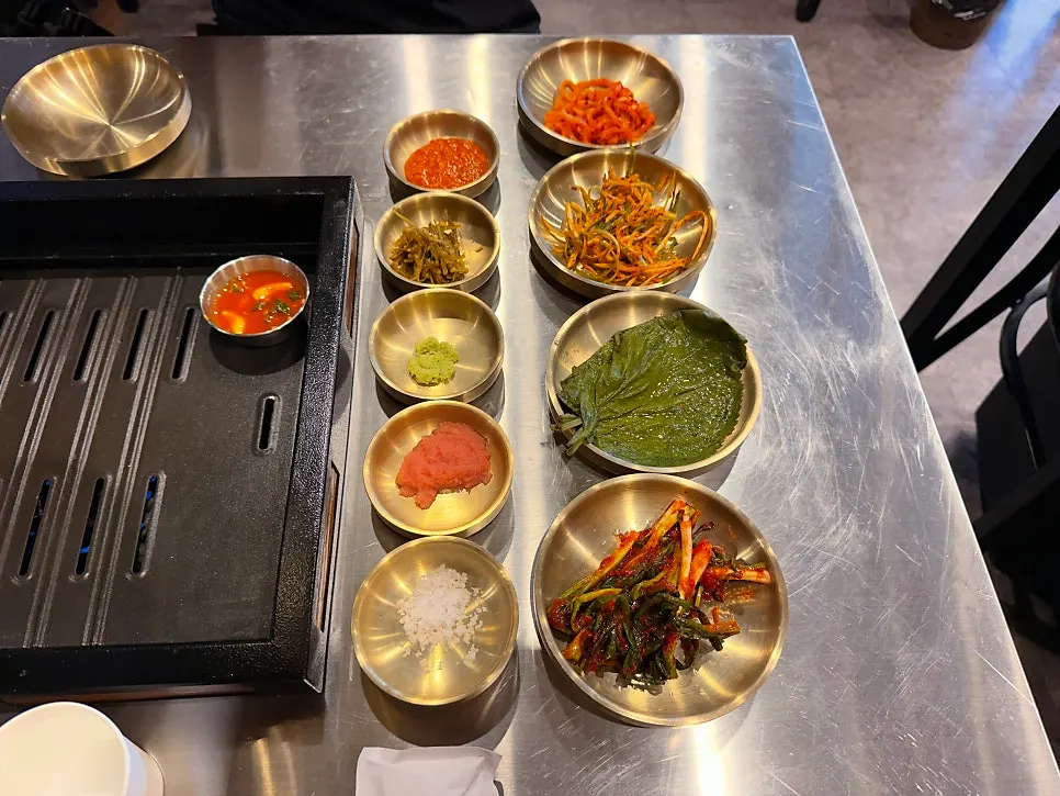 Sauce lineup of salt, wasabi, house sauce, and Jeju anchovy sauce