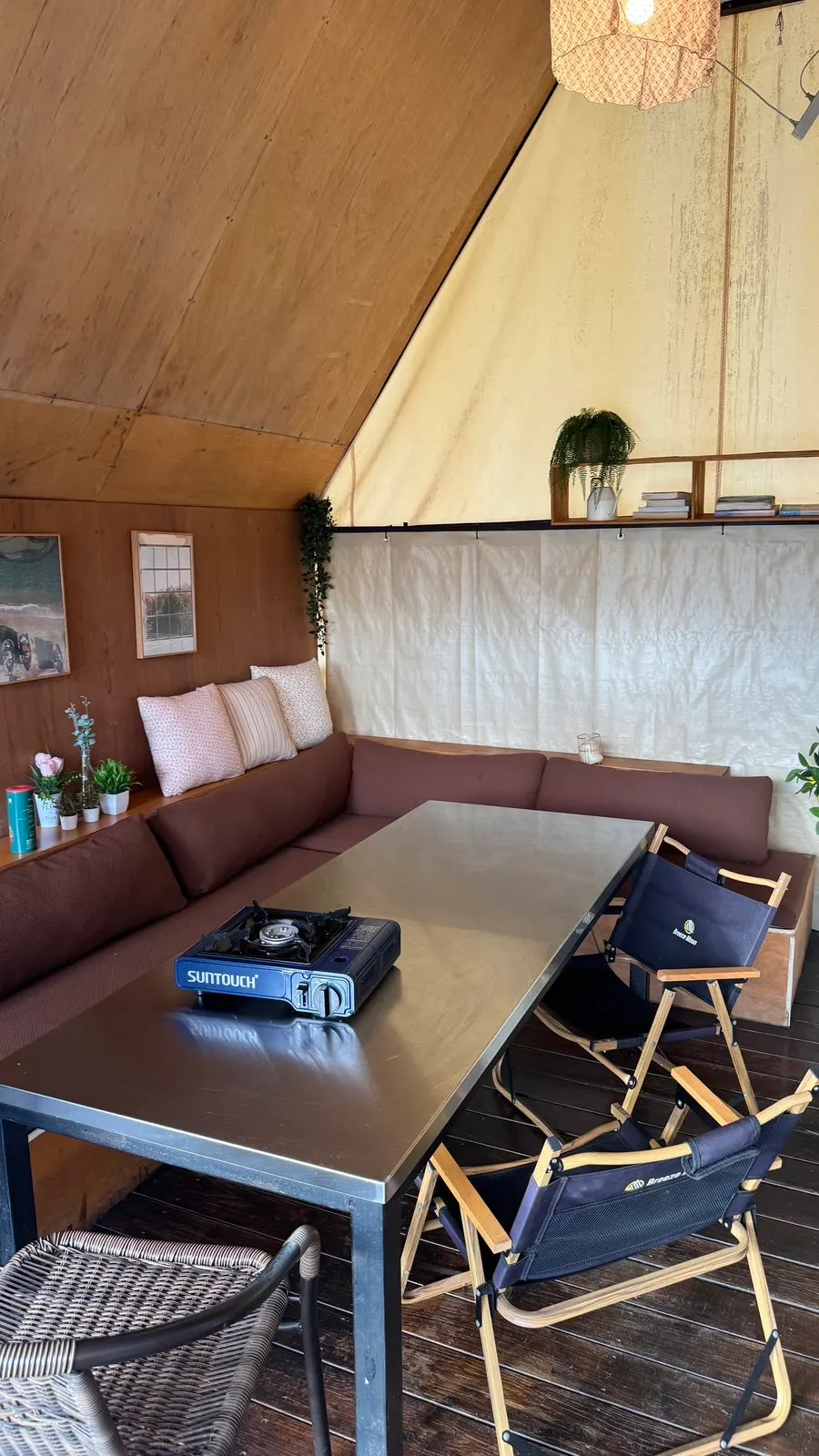 Inside a private tent with table and chairs