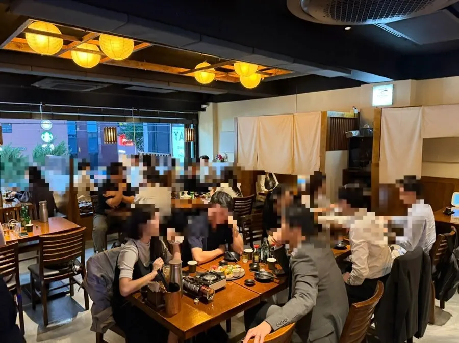 Full view of Izakaya Goko's interior packed with customers