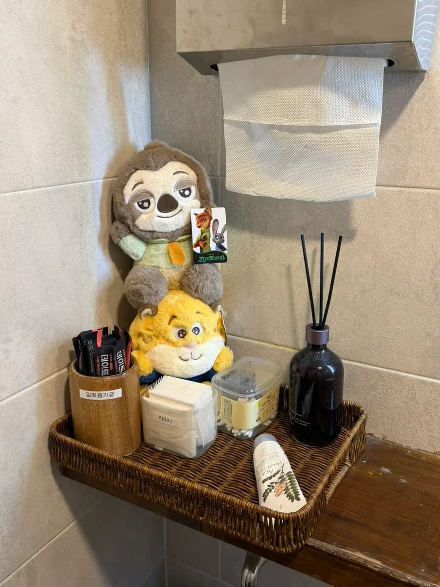 Doll decorations placed near the interior restroom