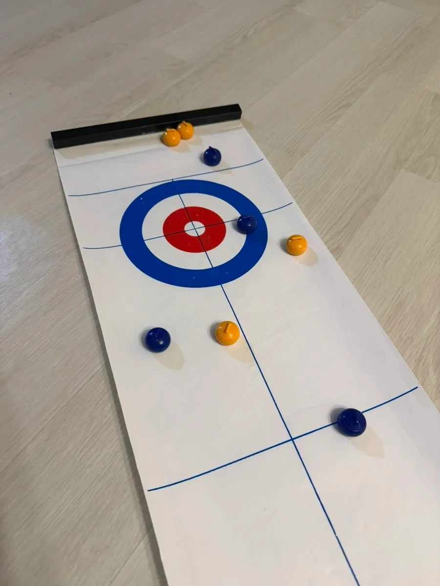 Curling board game played in the cabin