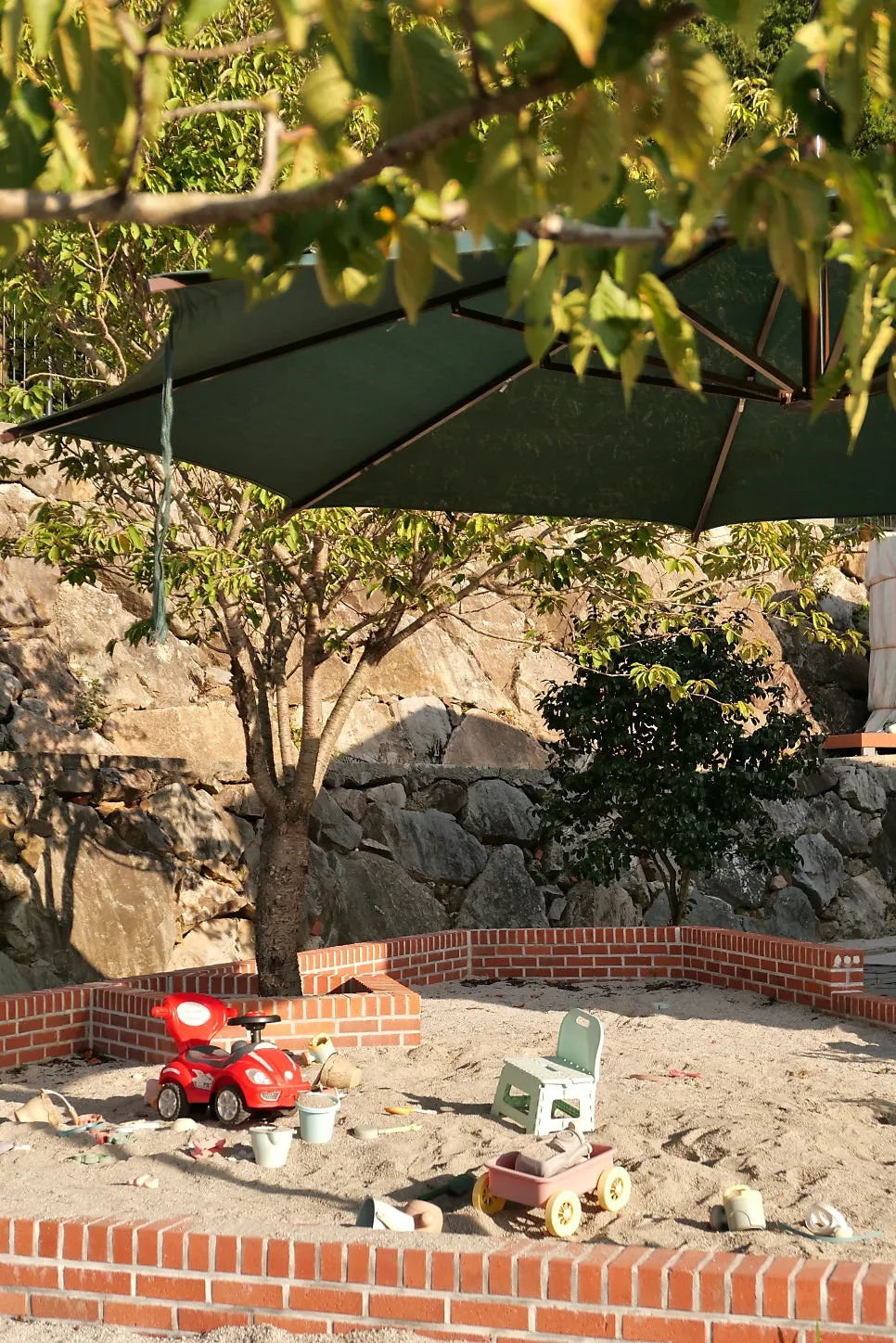 Children's sand playground beside the administration building