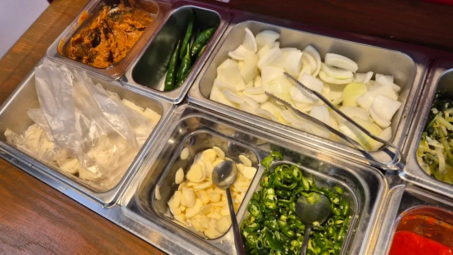 Self-bar with side dishes on one side of the restaurant