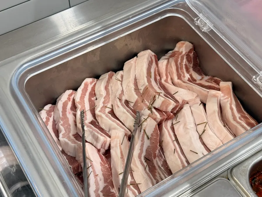 Self-serve bar stocked with eel, pork belly, and chicken neck