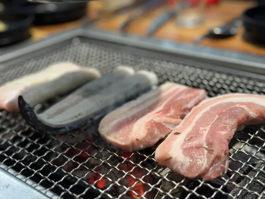 Pork belly and chicken neck grilled alongside the eel