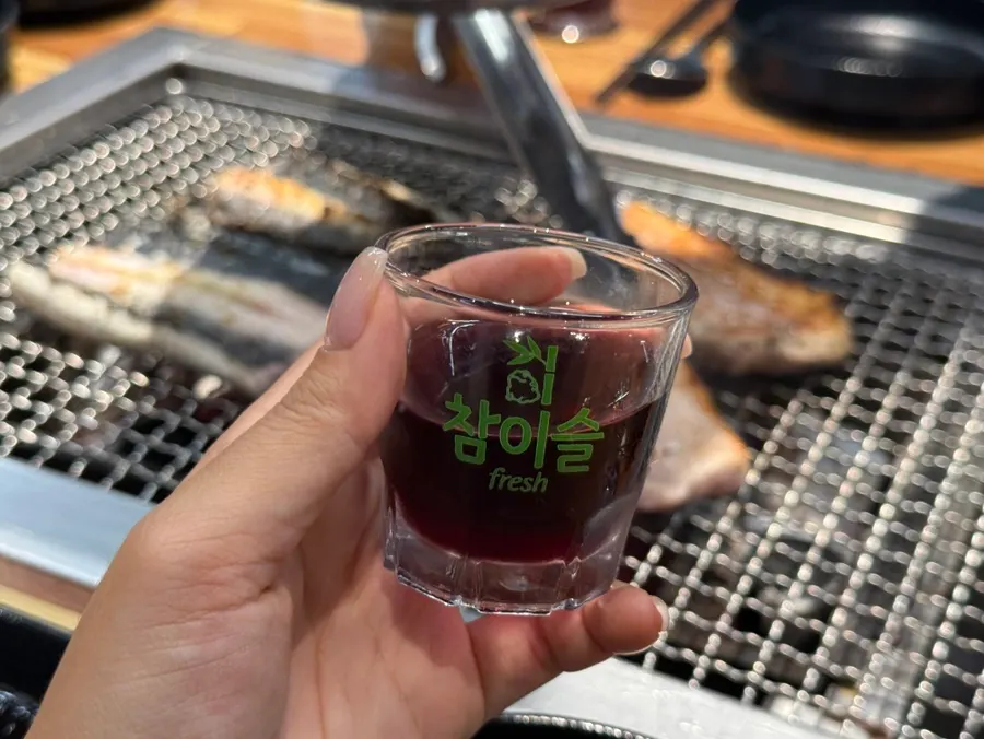 Bokbunja wine served alongside the eel